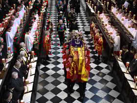 Soldiers of The Queen’s Company of the Grenadier Guards carry the coffin of Queen Elizabeth II