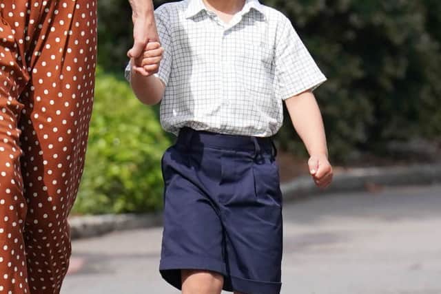 Prince Louis, accompanied by his parents the Prince and Princess of Wales.