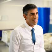 Prime Minister Rishi Sunak speaks with members of the media as he visits Croydon University hospital on October 28.