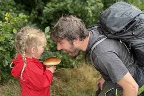 Jim Parums and his daugher foraging a mushroom - the family save £100 a week by foraging for all their meals. 