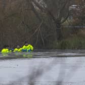 Rescue teams searching the freezing lake in Solihull for survivors.