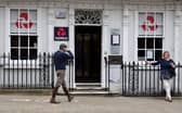 Customers use a NatWest bank on the High Street in Winchester, south west England on March 31, 2021. (Photo by ADRIAN DENNIS / AFP) (Photo by ADRIAN DENNIS/AFP via Getty Images)