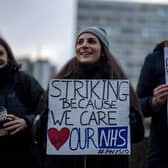 NHS physiotherapists take part in a strike outside of St Thomas’ Hospital on January. (Photo by Carl Court/Getty Images)