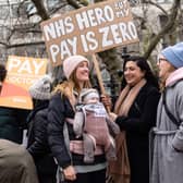 Demonstrators hold placards as they take part in a protest by junior doctors. Picture: NIKLAS HALLE’N/AFP via Getty Images