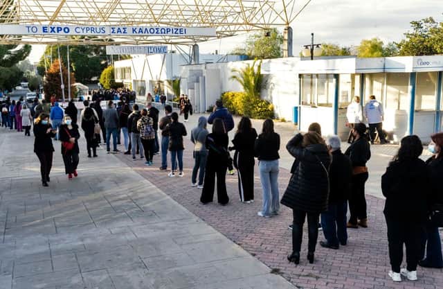 Cypriots wait in line to receive the third dose of a Covid-19 vaccine at a walk-in vaccination centre (Photo: Getty Images)