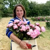 Elonor Tivey at her seven acre field in Leicestershire where she farms peonies. 