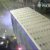 The car is seen smashing into the lorry.