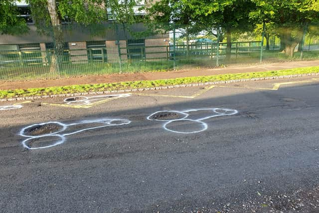 Locals appear to have lost patience waiting for the holey highway in East Sussex to be repaired - and the resulting crude phallus drawings have attracted interest online. 