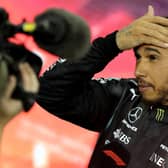 Second-placed Mercedes' British driver Lewis Hamilton reacts in the parc ferme of the Yas Marina Circuit after the Abu Dhabi Formula One Grand Prix on December 12, 2021 (Getty Images)