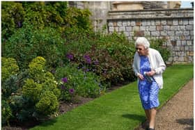 Queen Elizabeth II views a border in the gardens of Windsor Castle, where she received a Duke of Edinburgh rose, given to her by the Royal Horticultural Society (Photo by Steve Parsons - WPA Pool/Getty Images)