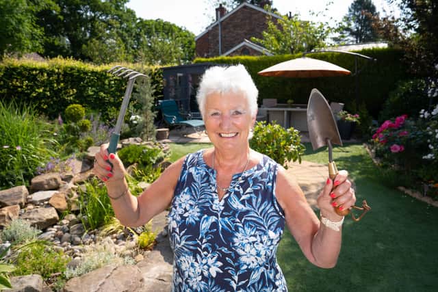 Karen Brooke, of Cheshire, who has turned her overgrown garden into a botanical haven on the cheap.