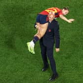 This picture taken on August 20, 2023 shows President of the Royal Spanish Football Federation Luis Rubiales carrying Spain's Athenea del Castillo Beivide on his shoulder as they celebrate winning the Australia and New Zealand 2023 Women's World Cup final football match between Spain and England at Stadium Australia in Sydney. 