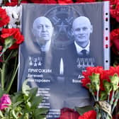 Sheet of paper with portraits of Yevgeny Prigozhin and Dmitry Utkin, a shadowy figure who managed Wagner’s operations and allegedly served in Russian military intelligence, is placed at a makeshift memorial in front of the Private Military Company (PMC) Wagner Centre in Saint Petersburg, on August 26.