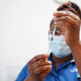 A nurse prepares a dose of a Covid-19 vaccine.