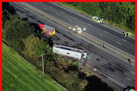 Emergency services at the scene of a coach crash on the M53 motorway, between junction 5 at Ellesmere Port and junction 4 at Bebbington. 