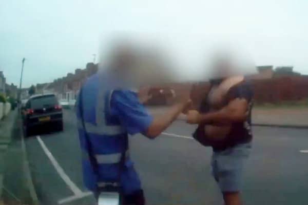 Shocking footage from a bodycam captured the moment a raging van driver threw a traffic warden to the ground after he ticketed his illegally parked van. Picture: Coventry City Council / SWNS