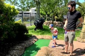 George accidentally hits his dad James between the legs at crazy golf.