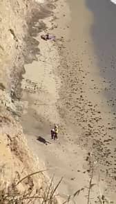 Surfer rescued from beach after spelling “Help” on the sand.