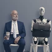 Man and AI robot waiting for a job interview
