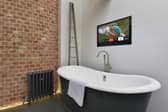 What a bathroom TV can look like. Photo: Frontline Bathrooms