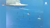 Disney cruise ship comes to the rescue of a sinking boat.