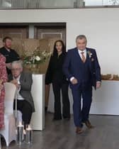 Neil Crossley walks down the aisle at his daughter's wedding, forgetting to take her with him, in Holmfirth, Yorkshire.