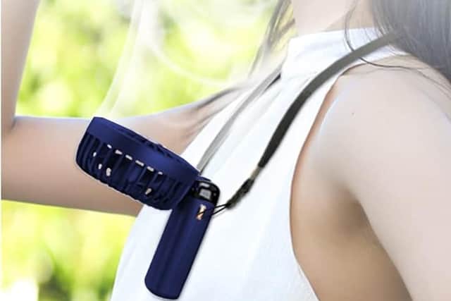 It folds up into a desktop fan, and can even be worn around your neck