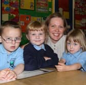 Teacher Diane Fleming with new P1 pupils Alan Boyd, Naomi Wilson, Samantha Hamill and Tyler Heigh, at Groggan Primary School, Antrim, in 2007