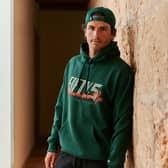 Formula 1 star Carlos Sainz is taking his style off the track with a brand-new fashion collaboration with New Era