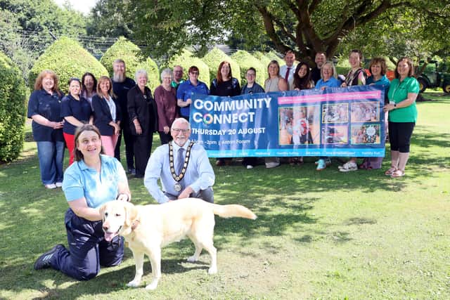 The Mayor of Antrim and Newtownabbey, Councillor Henry Cushinan is joined by local organisations and Council Teams who will be exhibiting at the Community Connect event on 20 August in the Antrim Forum