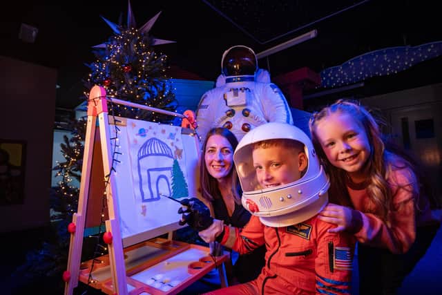 Leo (9) and Lucy (6) with Siobhan Rafferty, Communications and Marketing Manager at Armagh Observatory and Planetarium.