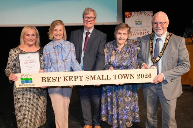 Randalstown residents and members of Tidy Randalstown collect their ‘Best Kept Small Town’ award.