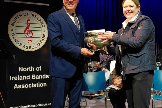 CWA Secretary Fiona Gray receiving the trophy for winning the second section at the contest from adjudicator Richard Marshall