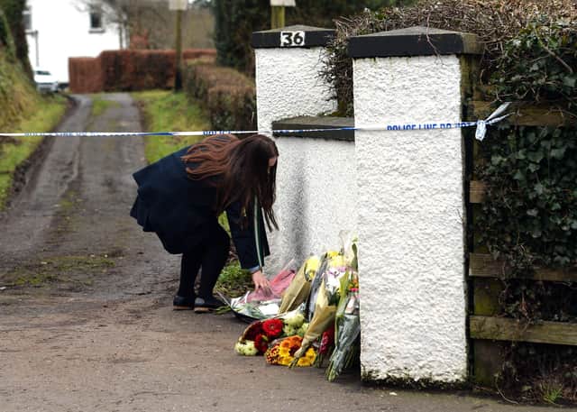 Flowers left at the scene of the murder in January 2018