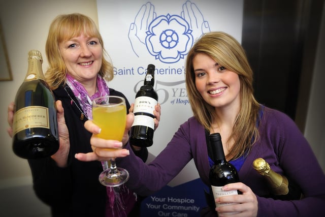 St Catherine's Hospice fundraisers Jane Richardson, left, and Amanda Welburn appeal for any Christmas leftover bottles of wine, which the hospice can 'recycle' as fundraising raffle prizes.