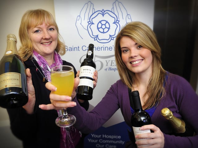 St Catherine's Hospice fundraisers Jane Richardson, left, and Amanda Welburn appeal for any Christmas leftover bottles of wine, which the hospice can 'recycle' as fundraising raffle prizes.