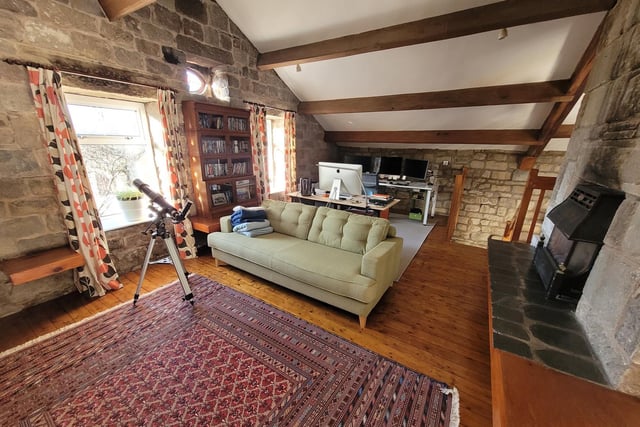 Exposed stone walls and beams feature throughout the stunning property.