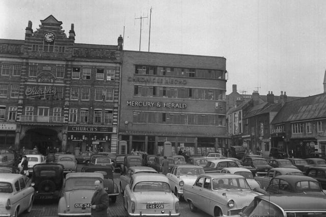 1964 showing Chron building and Emporium Arcade, which was demolished in the 1970s. When there was no market, the square became a popular free car park.