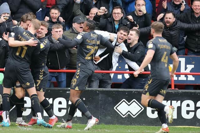 Dream start! Cobblers celebrate Louis Appere's early goal against Walsall. Pictures: Pete Norton.