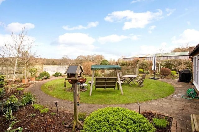The rear garden has been landscaped to include a central lawn bordered by flowerbeds and areas of shrubs and low hedging, space for dining furniture and room for garden storage. Picture: Hamptons - Haywards Heath Sales.