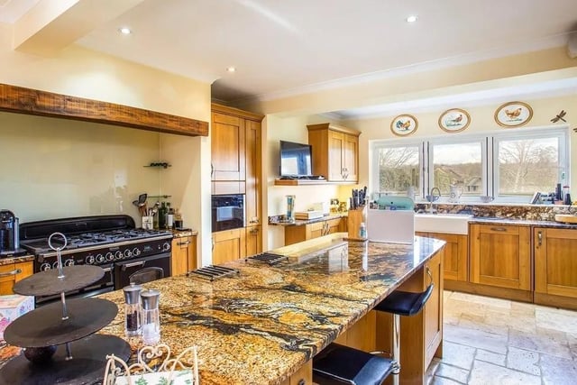 The beautiful open plan kitchen and breakfast room has a large central island. Picture: Hamptons - Haywards Heath Sales.