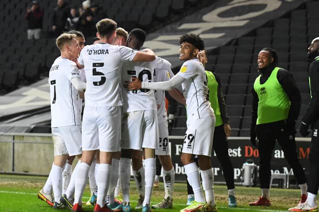 MK Dons celebrate Troy Parrott's opening goal on Tuesday night
