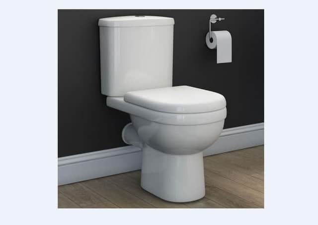 Toilet with toilet roll.