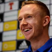 Shane Ferguson has extended his contract at Millwall.