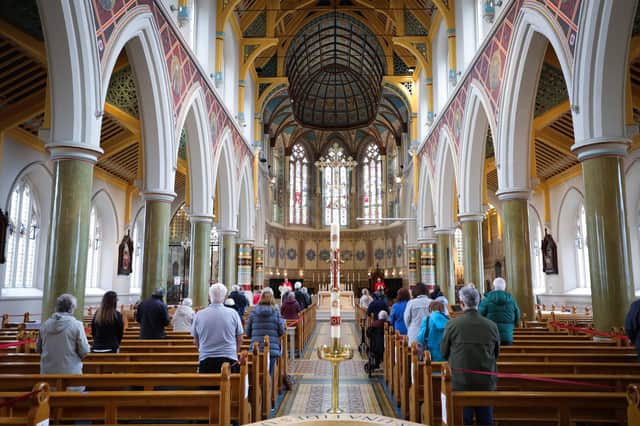 Bishop of Down and Connor Noel Treanor celebrates Mass under strict social distancing in St Peter’s Cathedral, west Belfast on Monday as churches reopened for worship
