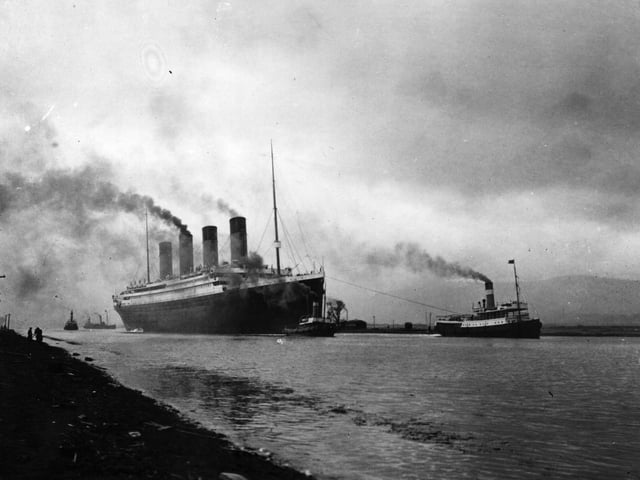 The SS 'Titanic', leaving Belfast to start her trials, pulled by tugs, shortly before her disastrous maiden voyage of April 1912. (Photo by Topical Press Agency/Getty Images)