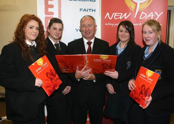 Kerry McCormick and Eimer McAuley, from St. Patrick's College, and Veronica Mooney and Kate Duncan, from St. Louis, with Irish Foreign Affairs Minister Dermot Ahern, at the launch of the New Day initiative. BT48-208AC