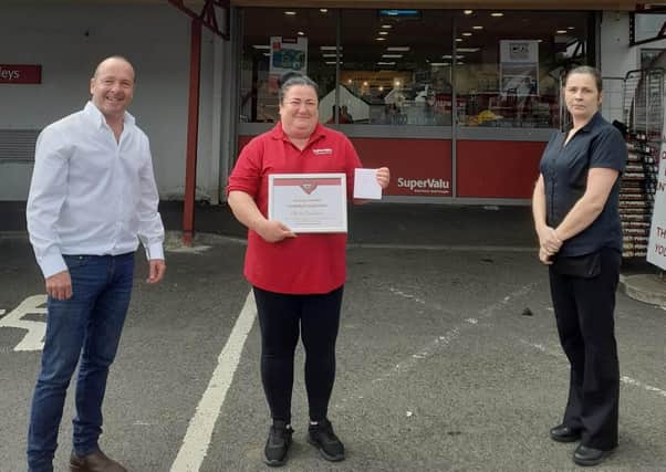 Olivia Davidson from SuperValu Kells (pictured centre) is one of two
County Antrim winners for the SuperValu and Centra Store Hero Competition.