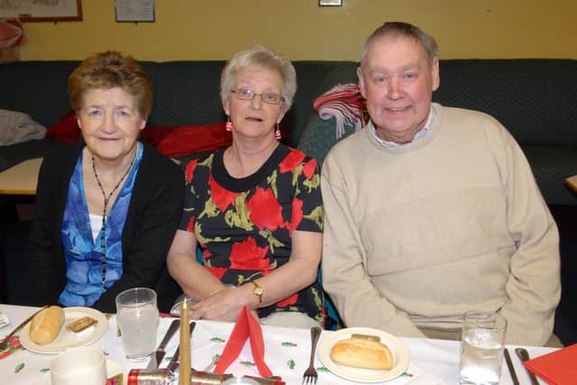 Millie McConnell, Noreen O'Neill and Albert Gilbert at the Larne RBL Over 50s dinner. LT01-329-PR