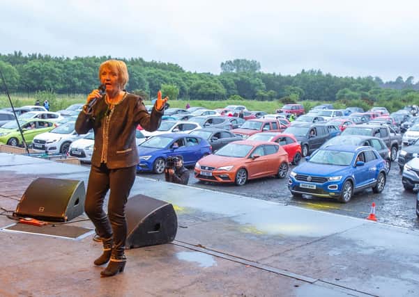 Philomena Begley performing for revellers who packed Ballymena Showgrounds for Northern Ireland's first drive-in country music concert. Photo: Paul Faith/PA Wire